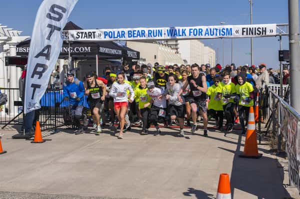 racers running through th efinish line
