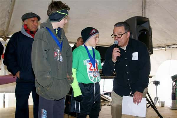 Announcer talking to two boys