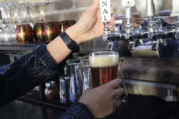 Pouring draft craft beer