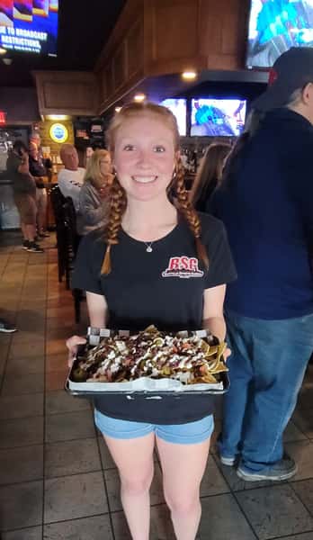 Waitress with Nachos at Cinco de BSG party