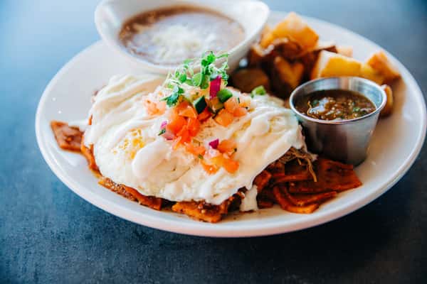 Birria topped Chilaquiles is a fine remedy for, well, everything! 🌶️ 🍳 😚 Join us at our Mercado location for brunch served 8AM ‘til noon on Saturdays and Sundays and served 8AM-11AM weekdays! #Breakfast #Brunch #Seis #Chilaquiles #Birria 📍 Seis at Mercado 130 S. Avenida del Convento also available for take out or delivery! 🏎️ Head to our site @seiskitchen
