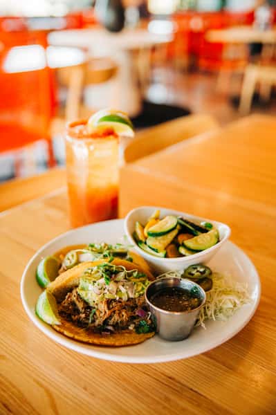 Michelada and Carnitas Tacos with sautéed Calabacitas