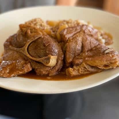 Smothered pork steak with rice and gravy