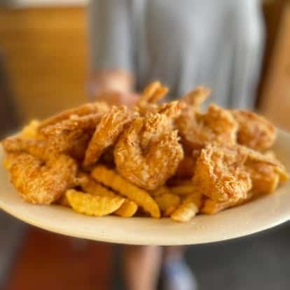 Fried butterfly shrimp with fries cooked to order