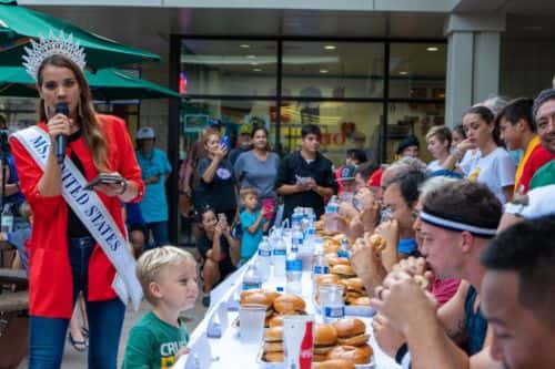 burger eating competition with Miss America