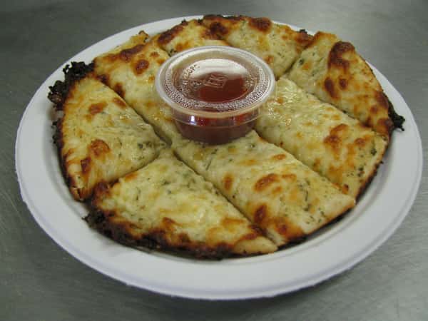 Cheesy calzone with a side of marinara sauce