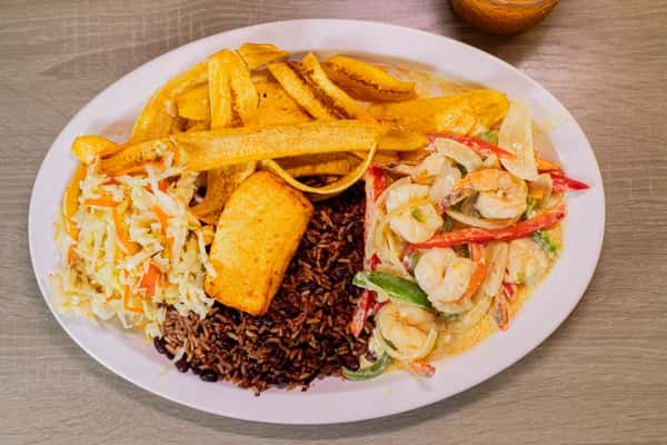 served with a creamy sauce, bell pepper and onions, Gallo pinto, Handmade Plantain chips or sweet soft plantain, fried cheese and cabbage salad