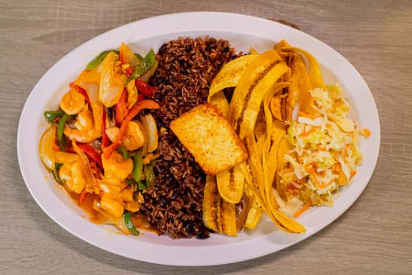 shrimps with Garlic, served with Gallo pinto, Handmade Plantain chips or sweet soft plantain, fried cheese and cabbage salad