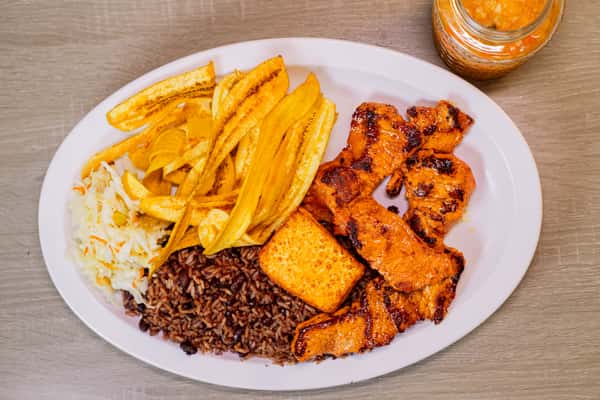 served with Gallo pinto, Handmade Plantain chips or sweet soft plantain, fried cheese and cabbage salad