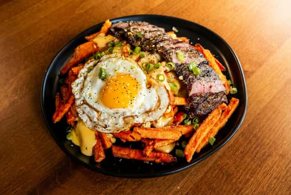 Seasoned eggs and meat with fries