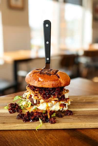 Burger with knife through bun