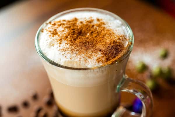 Close up of coffee with a sprinkle of cinnamon
