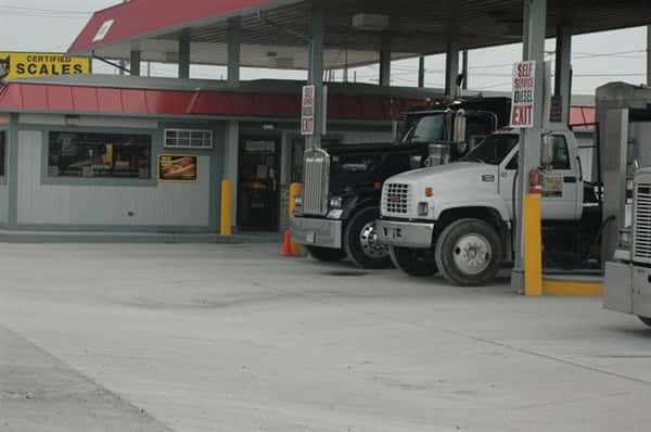 trucks filling up for gas at the pumps