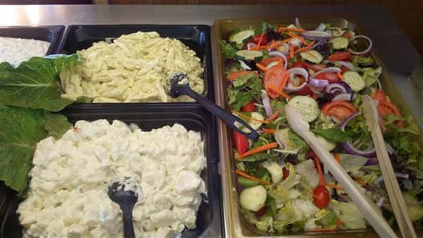 buffet assortment of salad, egg salad and potato salad