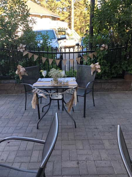 Outdoor brick area with tables and chairs