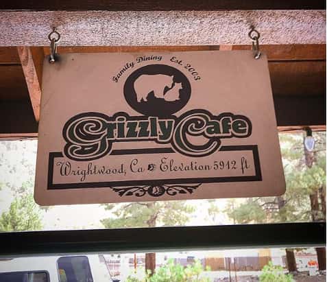 Sign hanging from the ceiling with the Grizzly Cafe logo