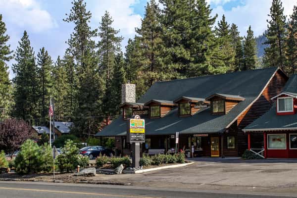 The exterior of Grizzly Cafe and parking lot from the opposite side of the road