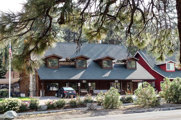 Left Side exterior shot of Grizzly Cafe from under a tree on the opposite side of the road