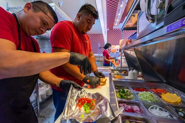 Team members preparing food