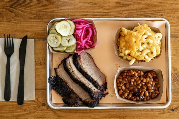 BBQ tray loaded with meats and sides
