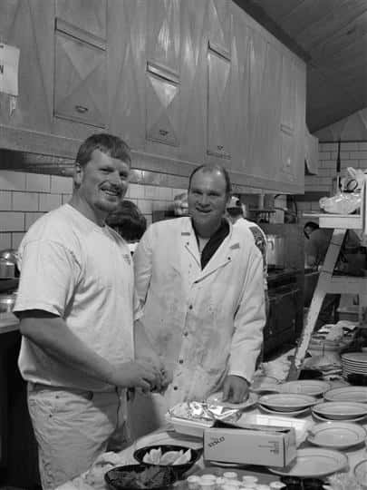 Two chefs cooking in the Archie's Waeside kitchen