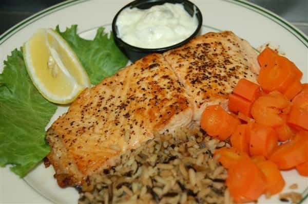 Grilled salmon plate with rice, and carrots.