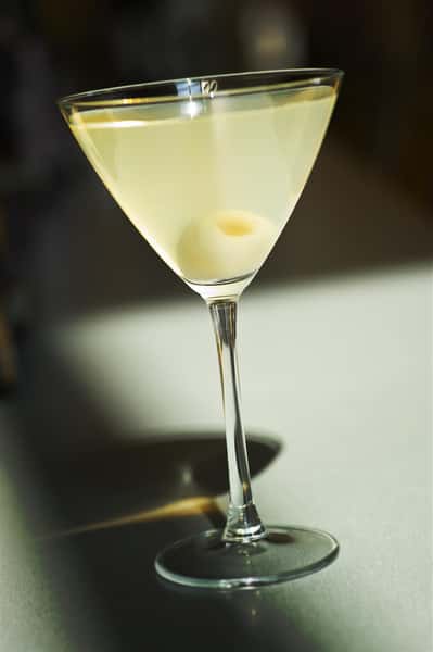 dirty martini with an olive in the glass
