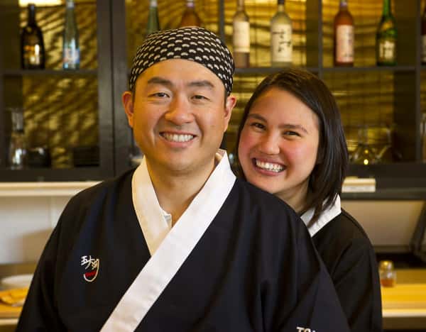 chef and partner smiling together inside the restaurant