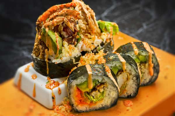 sushi roll with crab tempura, avocado, and spicy mayo