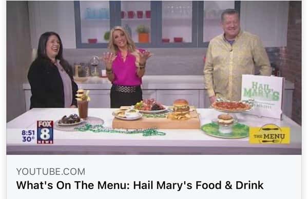 Three people in a still shot from a recorded news segment