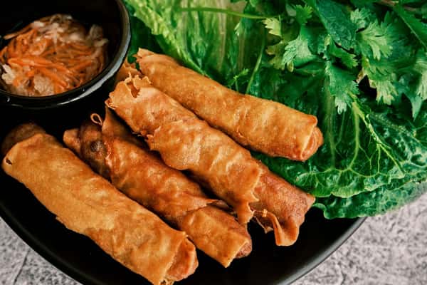 Crispy fried bites with a side of salad and greens