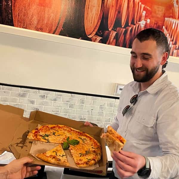 Customer enjoying a slice of pizza