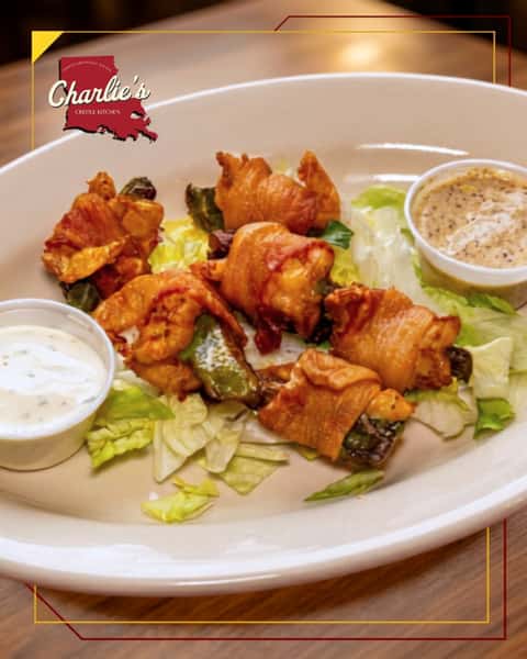 Need a bite with a little crunch and a lot of flavor? Bacon-Wrapped Shrimp brings smoky bacon, plump shrimp, jalapeño, and bold Cajun goodness together.
Add an order to your meal at Charlie's Creole Kitchen. Link in bio to order.
#charliescreolekitchen #eastdallas #dallasfood #dallastx #dallasfoodies #charliescreoledtx #LowerGreenville #dallas #dallasmardigras #dallascatholic #stthomasaquinasdallas #lowergreenvilledallas #eastsidedallas #lakewooddallas #mstreetsdallas