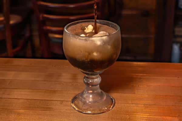 Pouring Root Beer Float