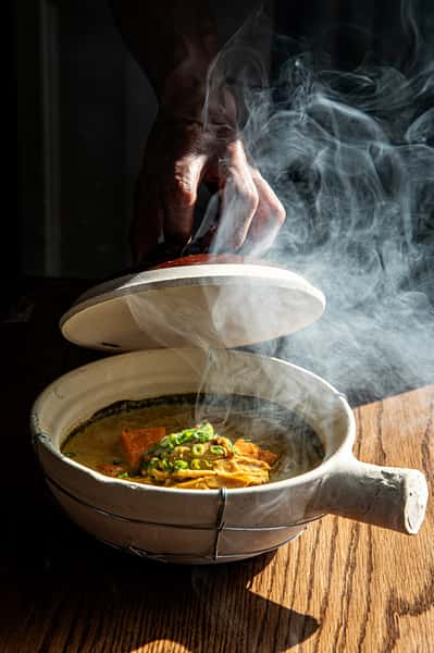 Steaming pot of soup