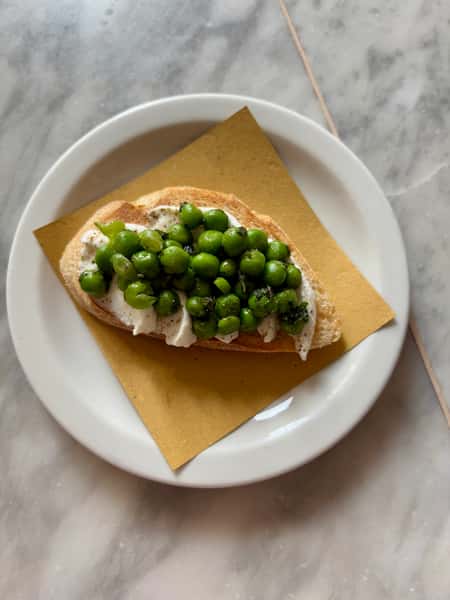 Goat curd, peas & mint crostino