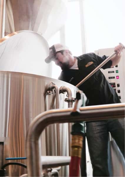 person brewing beer