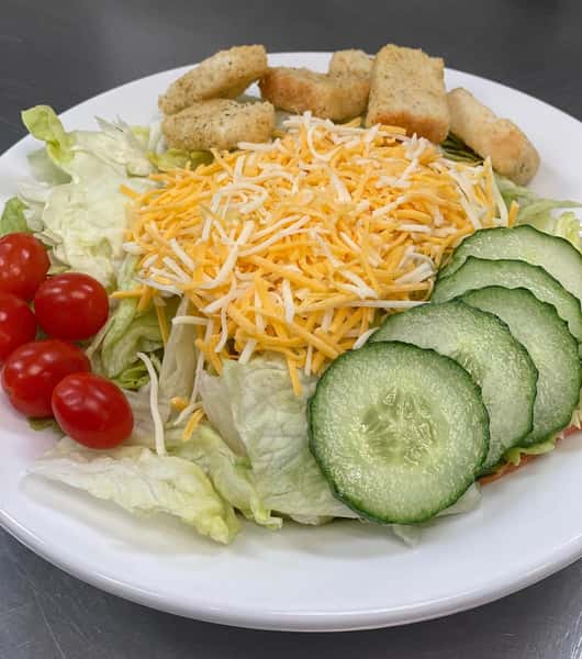 salad with cherry tomatoes, cucumber, cheese, and croutons