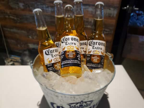 bucket of Corona beers in ice