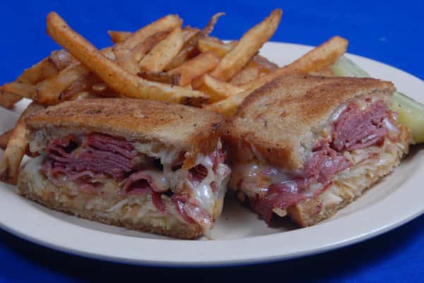 Rueben sandwich served with French fries