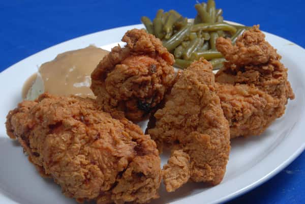 Fried bites served with dipping sauce and green beans