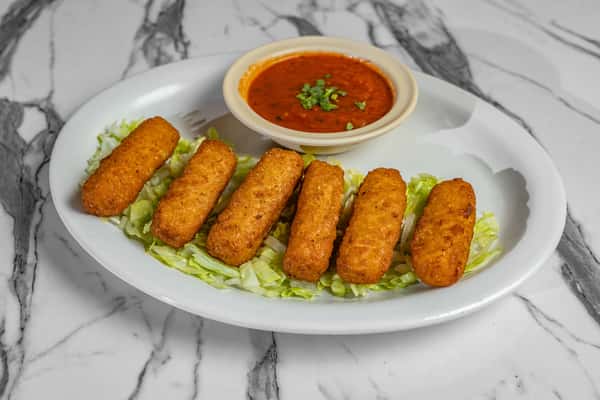 Crispy golden mozzarella sticks served on a bed of shredded lettuce with a side of zesty marinara dipping sauce.