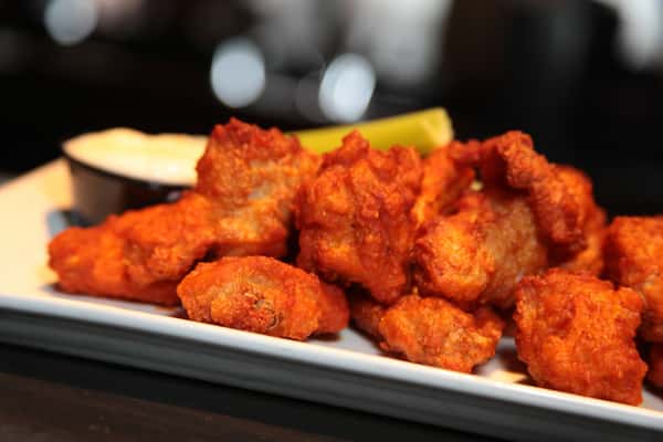 Close-up of buffalo chicken wings with bleu cheese and celery