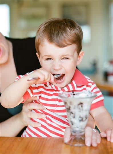 young child eating ice cream