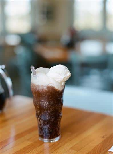 root beer float on a wooden table