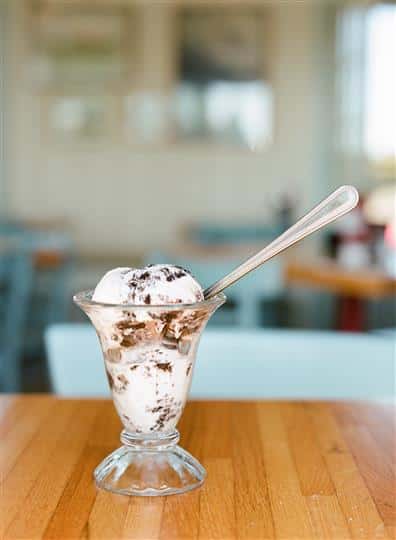 cup of ice cream on a wood table