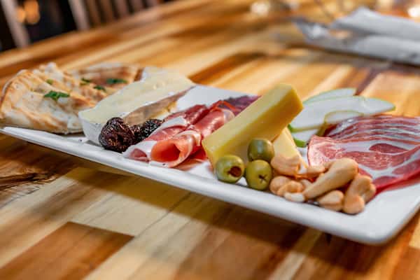 sliced meats, cheese, olives and pita