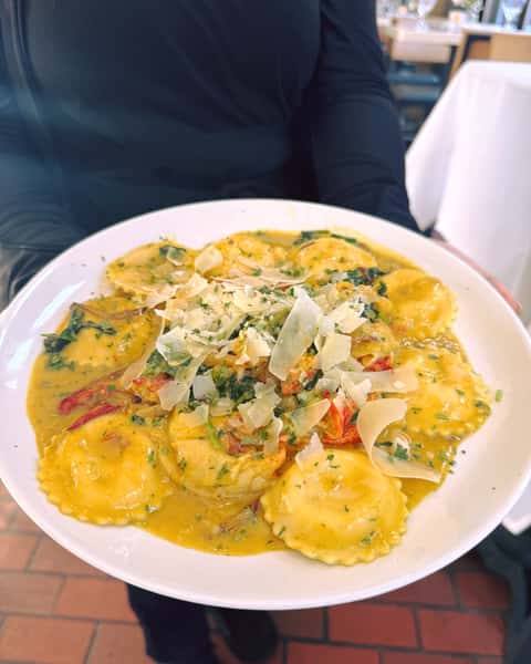 Get out of the rain and dive into this delicious dish of Calabrian Chili Ravioli with lots of fresh lobster and thank us later! Cheers to the weekend 😜