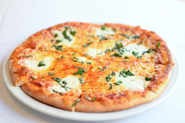 Margherita pizza with fresh mozzarella, tomato, basil, and herbs at Novara restaurant in Milton