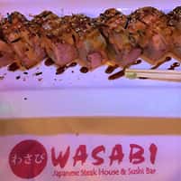 sushi roll with chop sticks